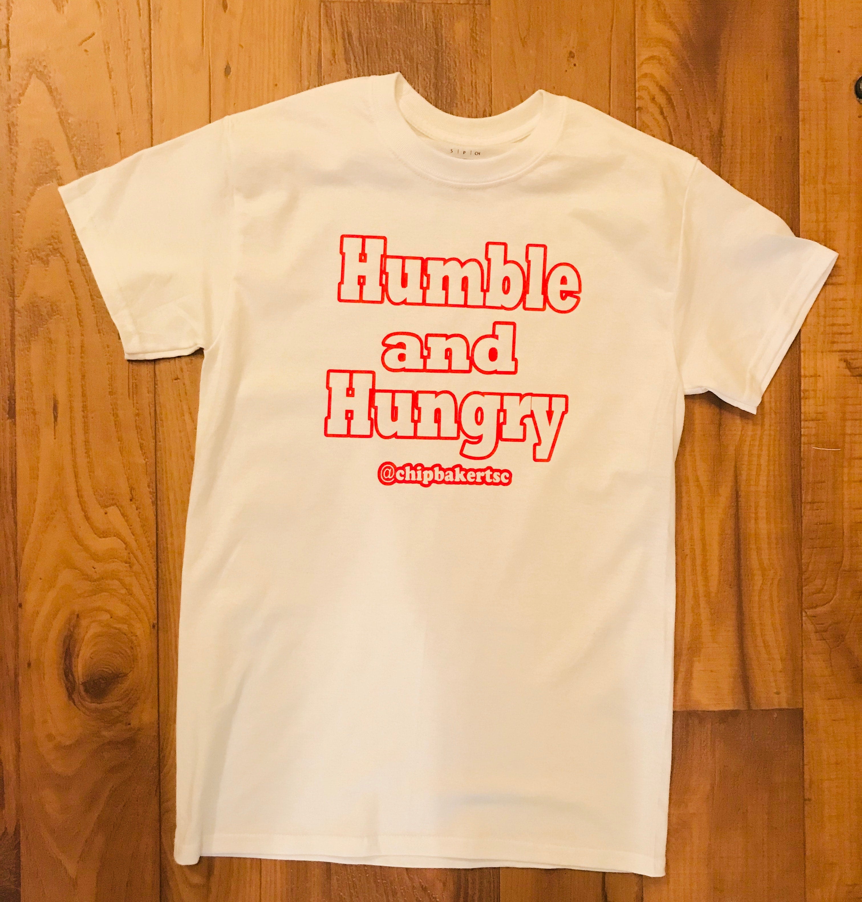 white t shirt with red writing